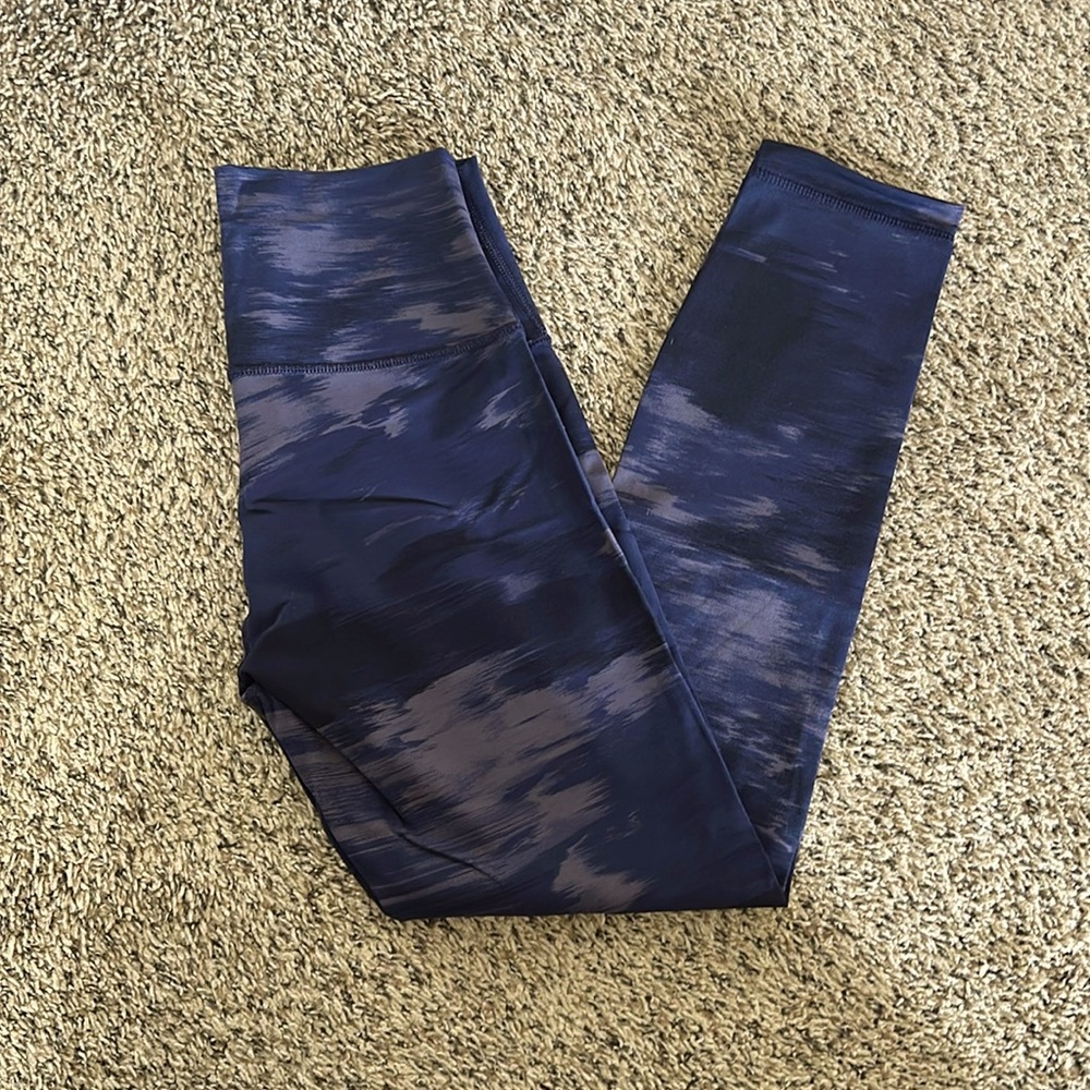 Lululemon gently used high times pant. 7/8 length in size 6. Navy/purple